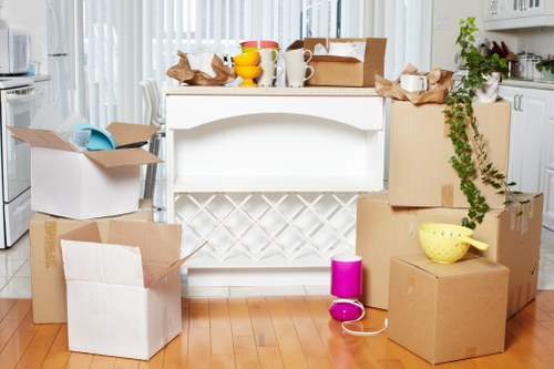 Professional movers loading furniture during a house removal in Upperwalthamstow